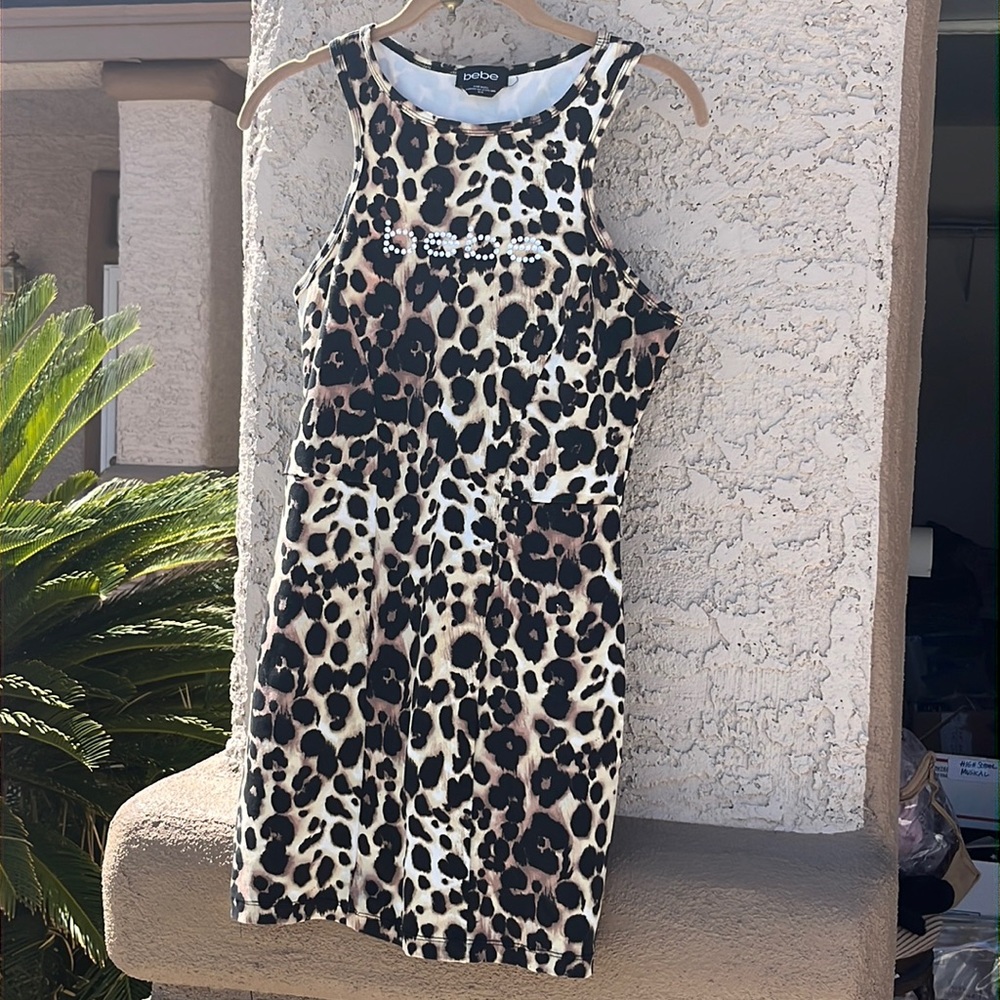 Bebe mini dress with rhinestones, nylon and Spandex. Excellent condition. Size M